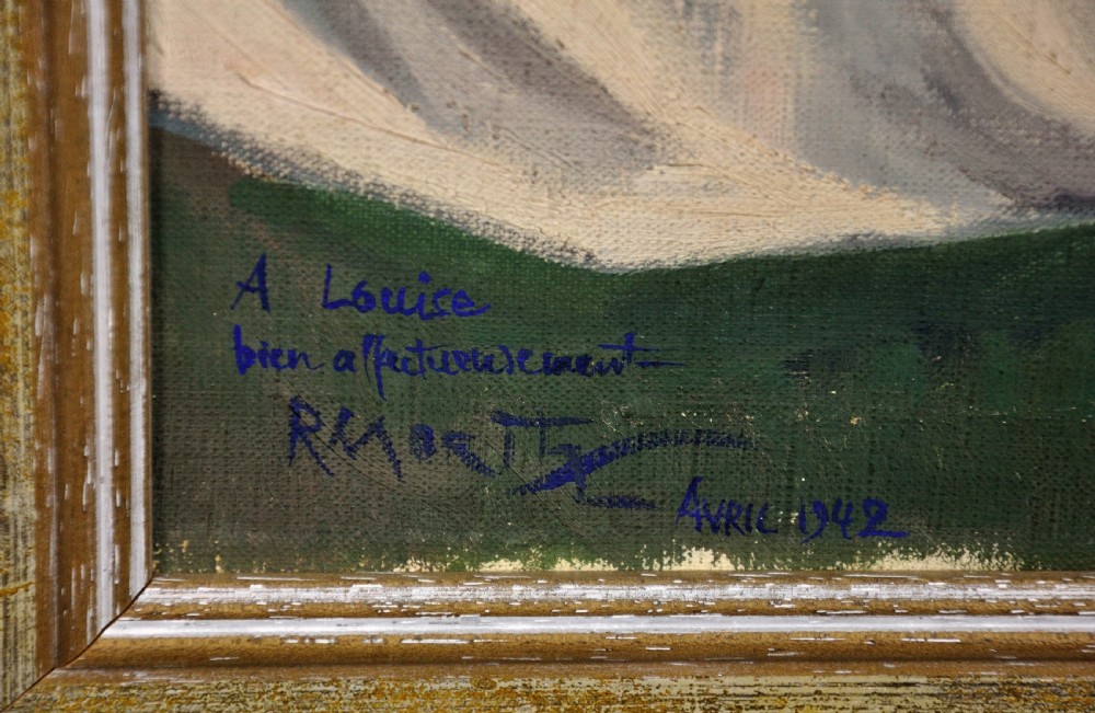 A framed 1920s oil painting depicting a nude female figure seated on a grassy cliff adjusting a red headscarf, with a coastal bay and sea cliffs in the background. View III