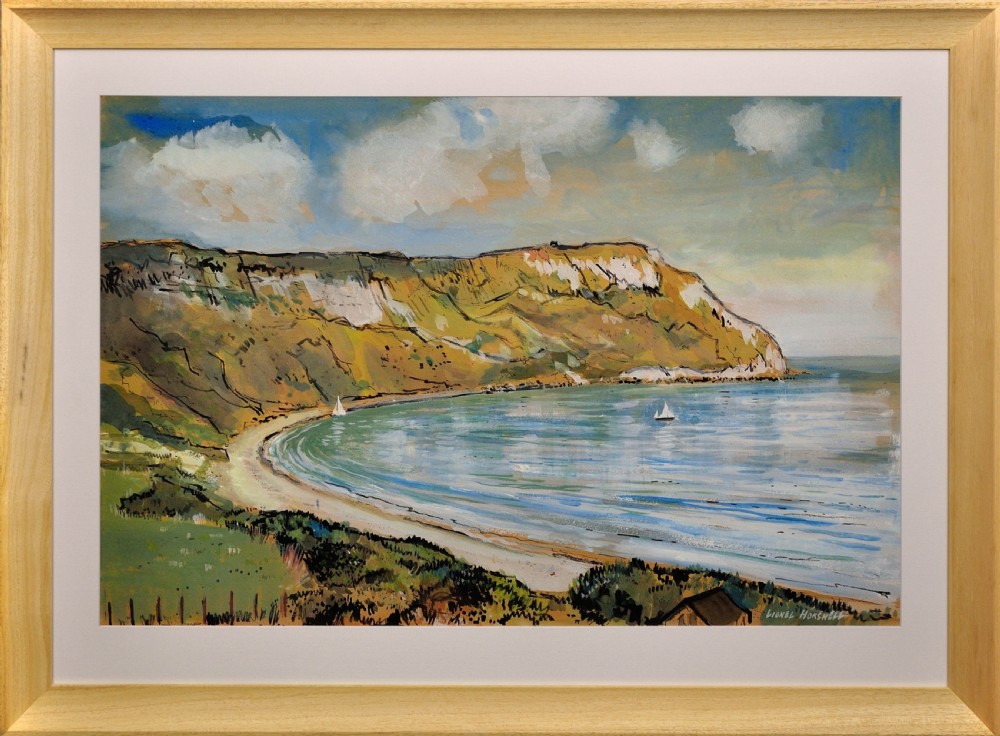 A 1960s framed watercolour painting depicting a sweeping coastal bay with chalk cliffs and sailboats, set in a light wood frame.