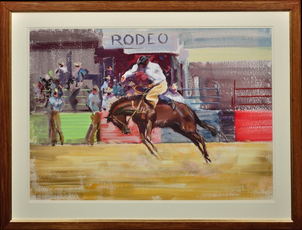A framed mid-20th-century painting depicting a cowboy riding a bucking brown horse inside a rodeo arena with spectators in the background.