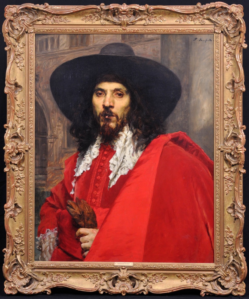 A 19th-century oil portrait of a dark-haired man in a black hat, lace collar, and red cloak within a gilded frame.