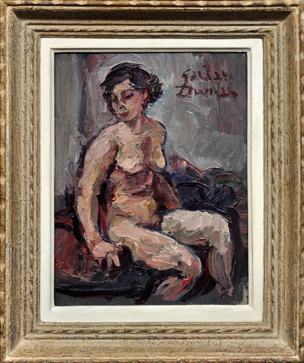 A framed 1930s French oil painting depicting a seated female nude rendered in impasto brushstrokes against a grey background inside a cream frame.