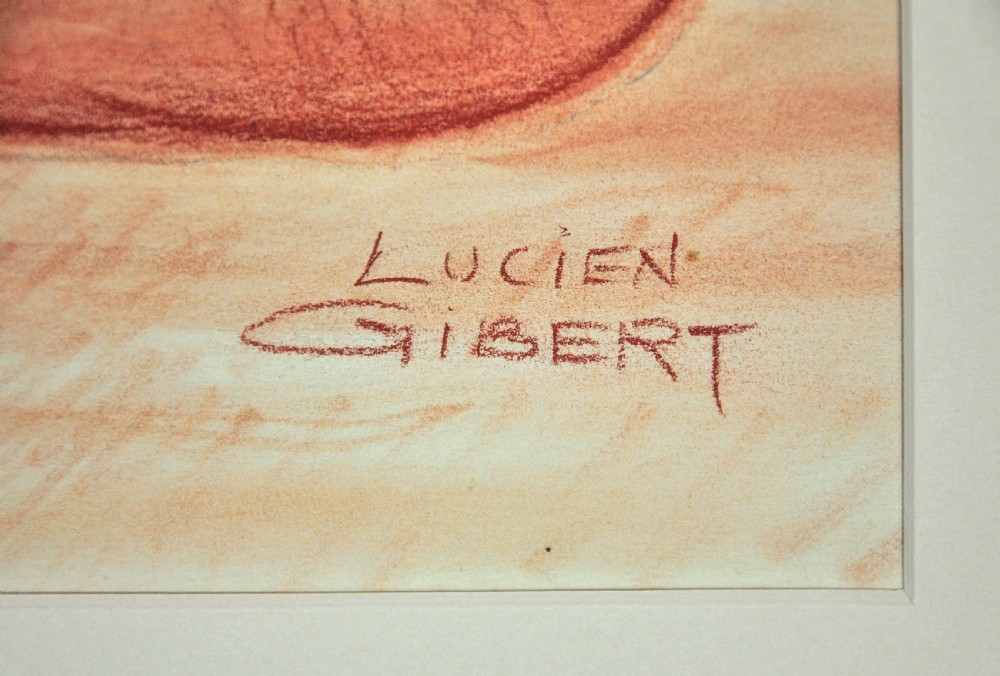 A framed 1930s Art Deco sanguine chalk drawing depicting a crouching female nude holding her auburn hair, signed by Lucien Gibert. View IV