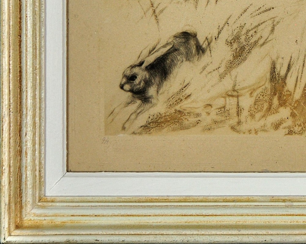 A 1920s hand-coloured Art Deco etching by Louis Icart depicting two startled women in long grass with a fleeing hare, presented in a light cream moulded frame. View VI