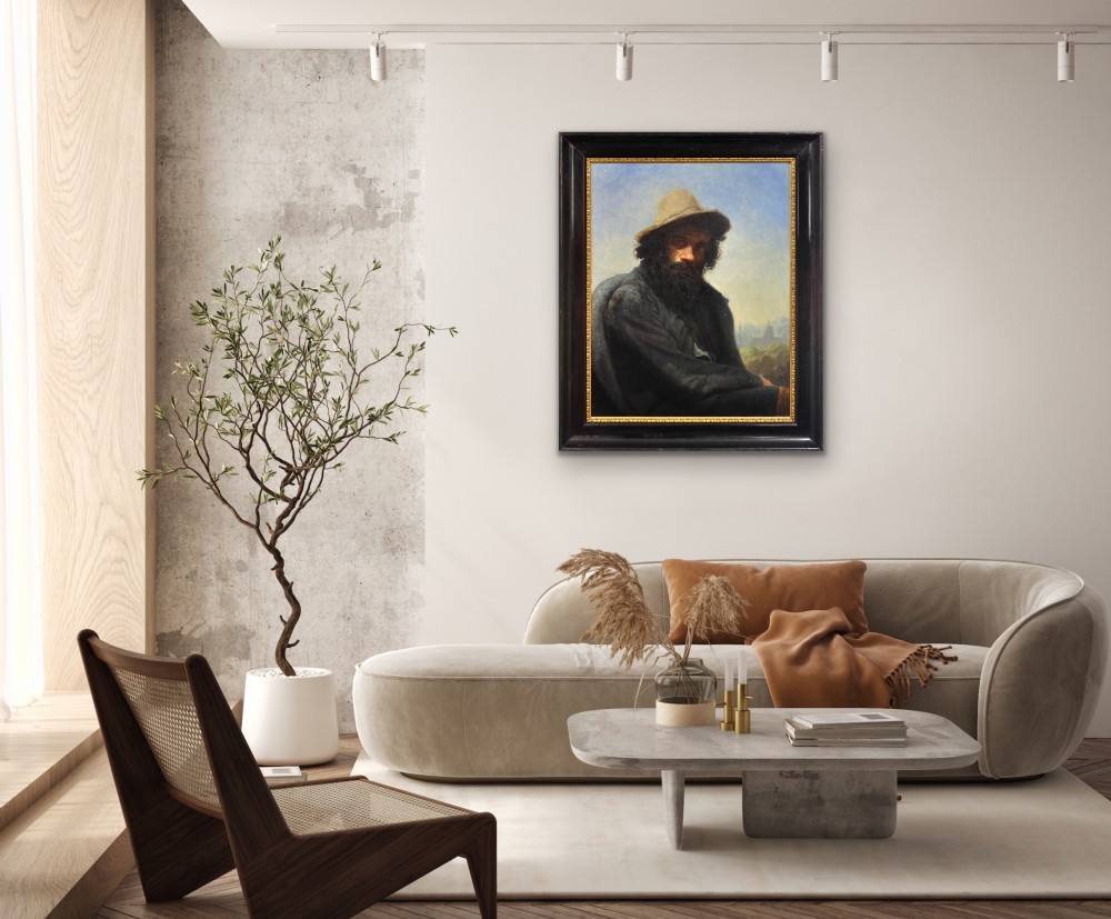 A 19th-century framed oil portrait depicting a bearded man wearing a hat and dark coat against a soft landscape background, housed in an ebonised frame with a gilt slip. View XI