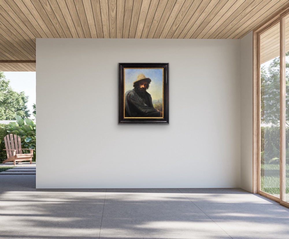 A 19th-century framed oil portrait depicting a bearded man wearing a hat and dark coat against a soft landscape background, housed in an ebonised frame with a gilt slip. View XII