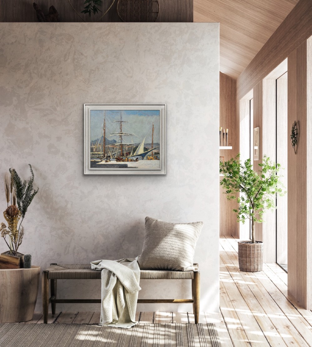 A framed 1930s oil painting depicting masted ships and horse-drawn carts along a harbour dock under a grey sky. View XII