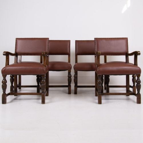 fig 1. A set of six dark oak dining chairs featuring brown leather upholstered seats and backrests with brass stud detailing and turned front legs.