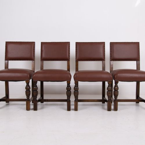 fig 2. A set of six dark oak dining chairs featuring brown leather upholstered seats and backrests with brass stud detailing and turned front legs.
