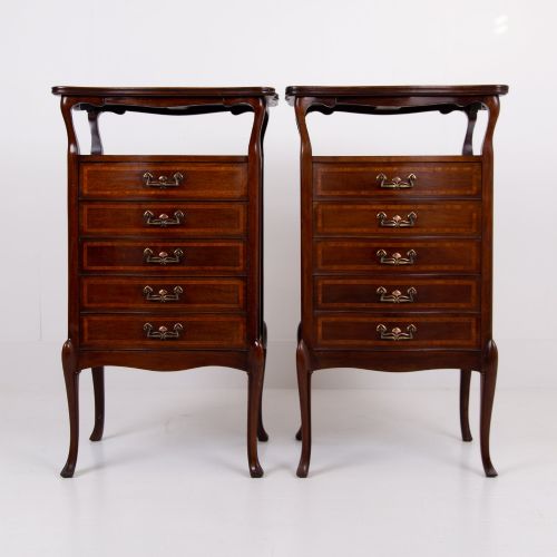 fig 1. A matching pair of dark mahogany Edwardian cabinets featuring five inlaid drawers, slender cabriole legs, and an open top tray shelf.