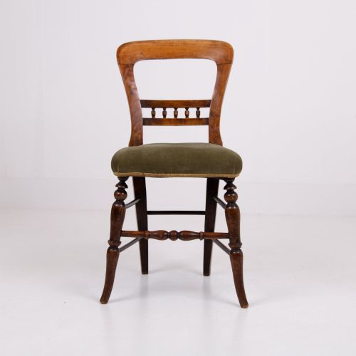 fig 1. A set of six late Victorian wooden dining chairs featuring curved open backrests with spindle galleries, turned front legs, and olive green velvet seats.