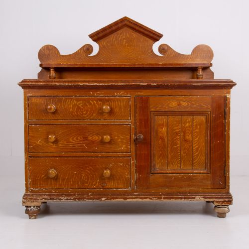 fig 2. A Victorian scumble-painted pine kitchen dresser with three drawers, a cupboard door, turned knobs, and a galleried splashback shelf.