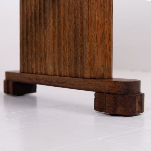 fig 2. An Art Deco medium oak dining set comprising a rectangular pedestal table and four matching chairs with brown leather seats.