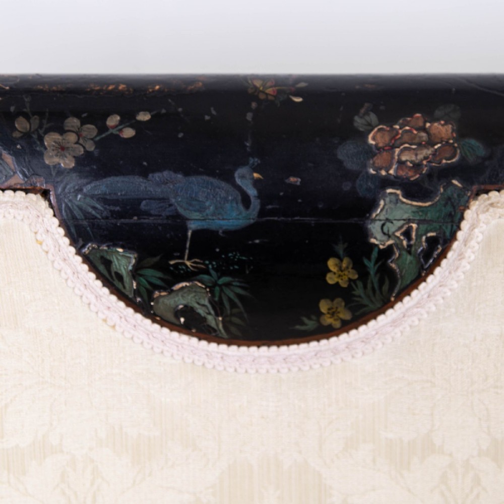 A Victorian Chinoiserie sofa with a black lacquered frame featuring gilt painted details, semicircular cream patterned back panels, and cream upholstered seat cushions. View XI