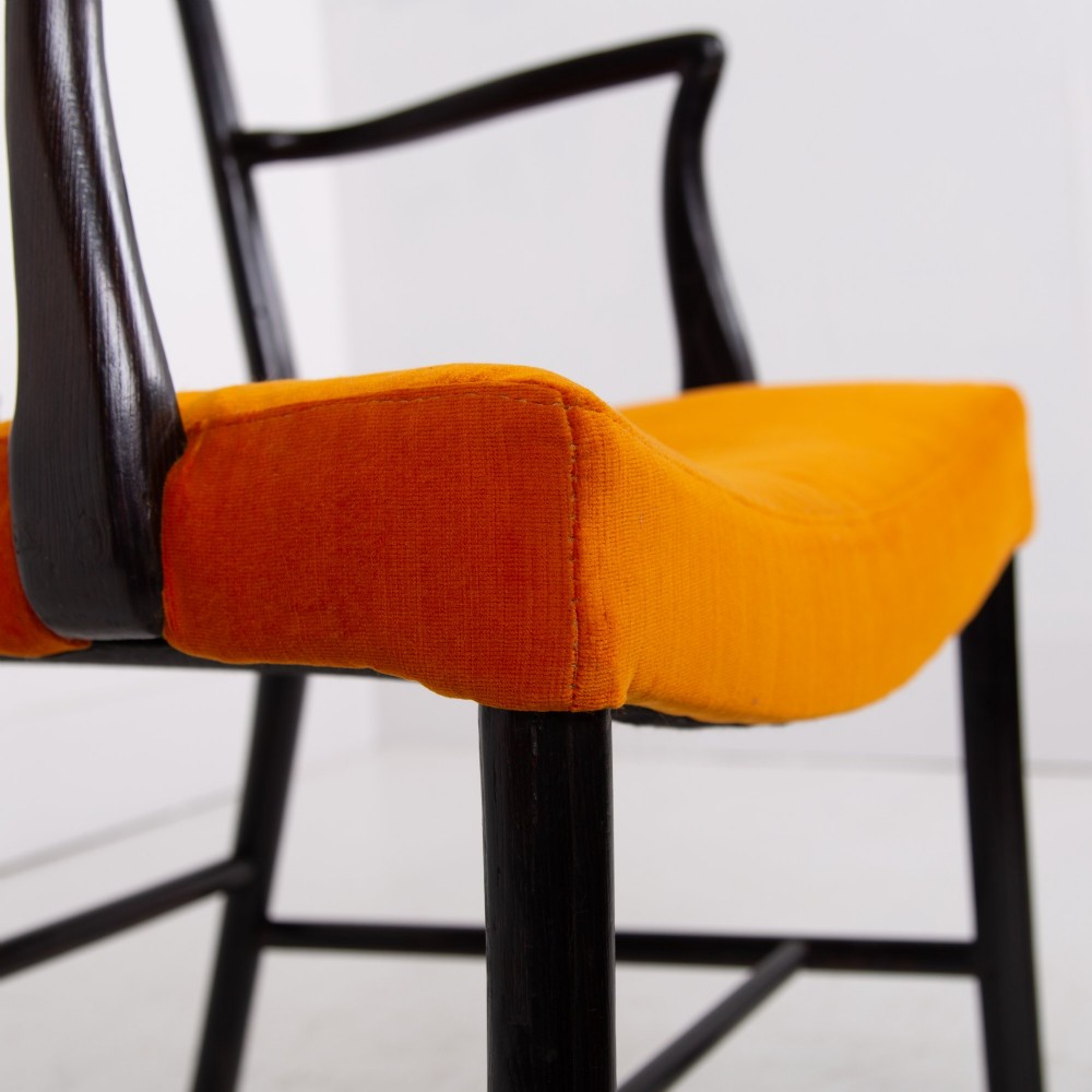 An ebonised wooden Cockpen armchair featuring a turned spindled backrest, curved armrests, and an orange velvet seat. View XIII
