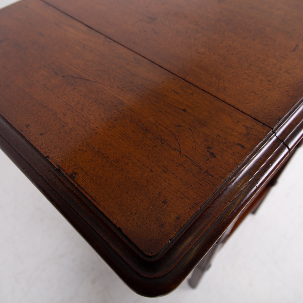 A late nineteenth-century dark mahogany drop-leaf table featuring a single top drawer with a brass pull, two lower open shelves, and fluted legs. View VIII