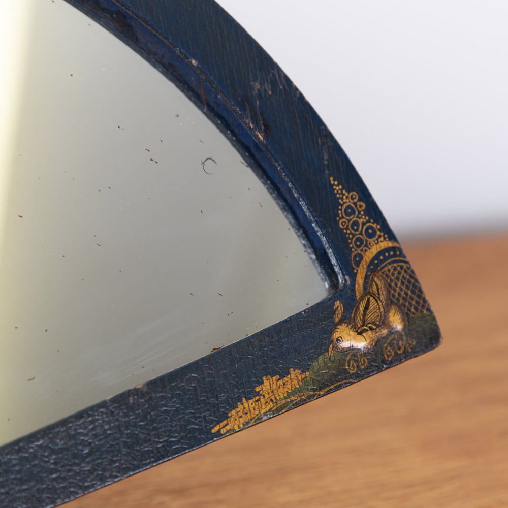 A small fan-shaped tabletop mirror with a black lacquered frame featuring hand-painted gold Chinoiserie detailing. View III
