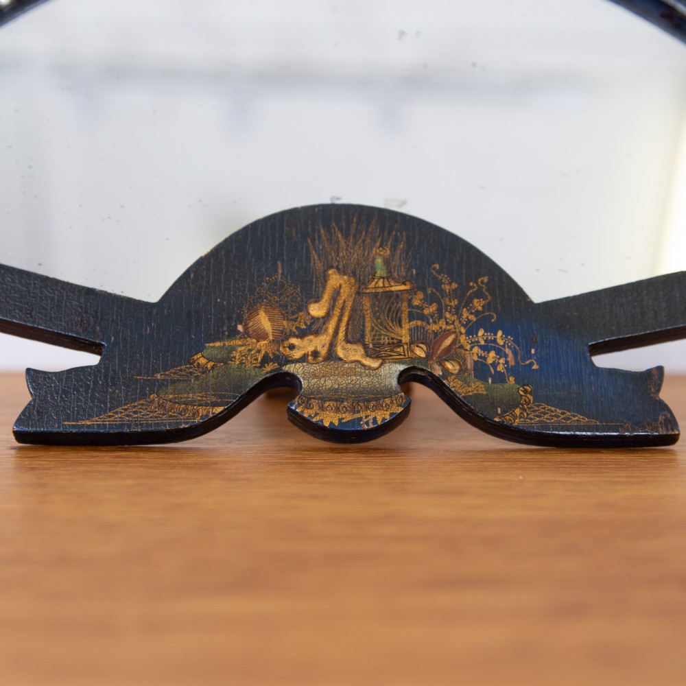 A small fan-shaped tabletop mirror with a black lacquered frame featuring hand-painted gold Chinoiserie detailing. View IV