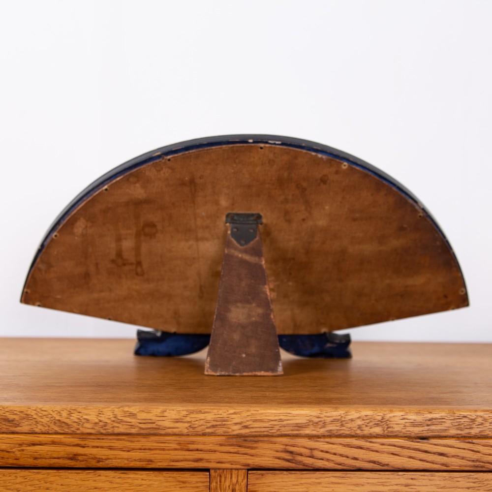 A small fan-shaped tabletop mirror with a black lacquered frame featuring hand-painted gold Chinoiserie detailing. View VI