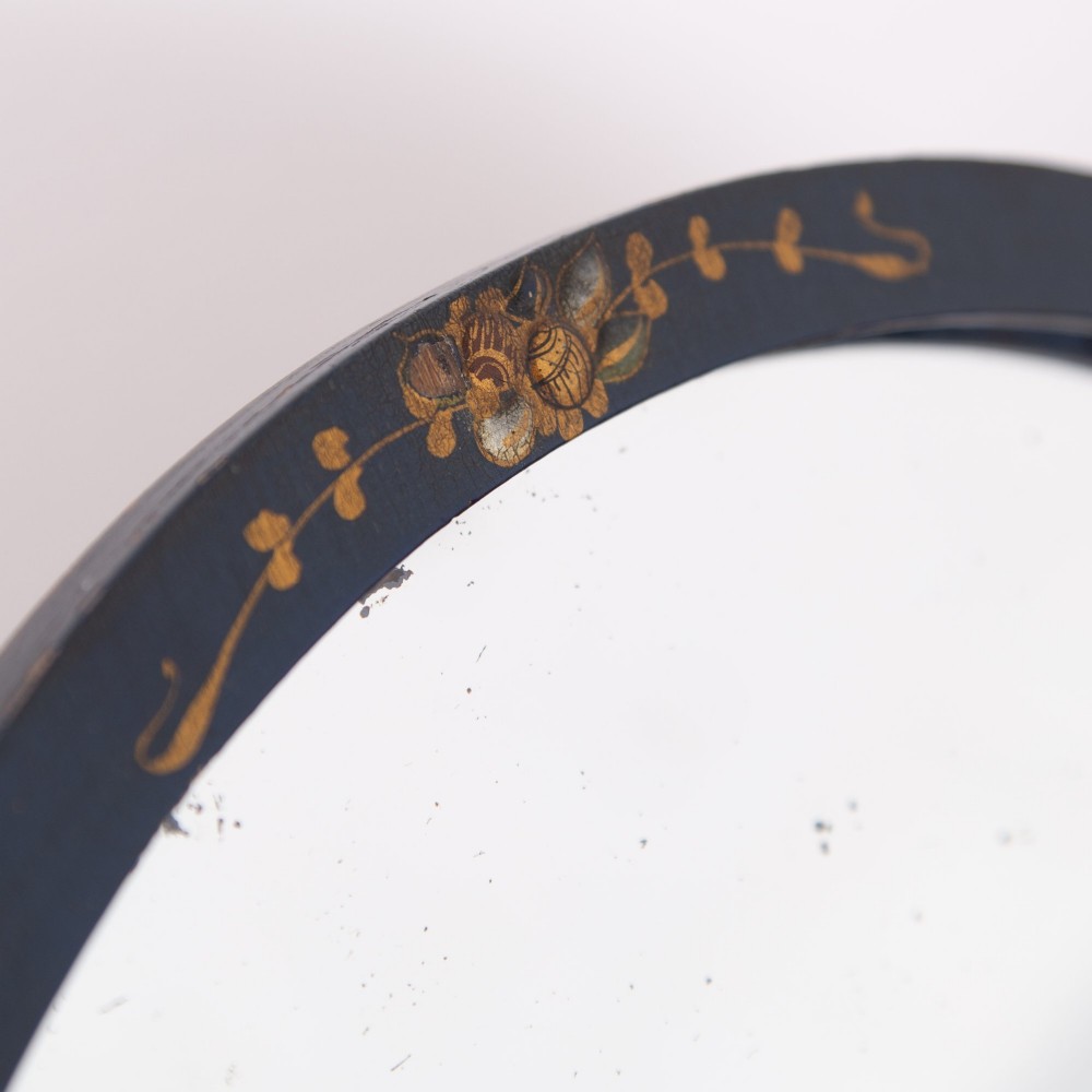 A small fan-shaped tabletop mirror with a black lacquered frame featuring hand-painted gold Chinoiserie detailing. View VIII