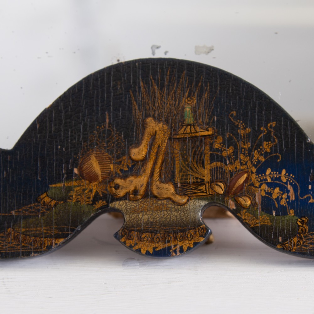 A small fan-shaped tabletop mirror with a black lacquered frame featuring hand-painted gold Chinoiserie detailing. View XI