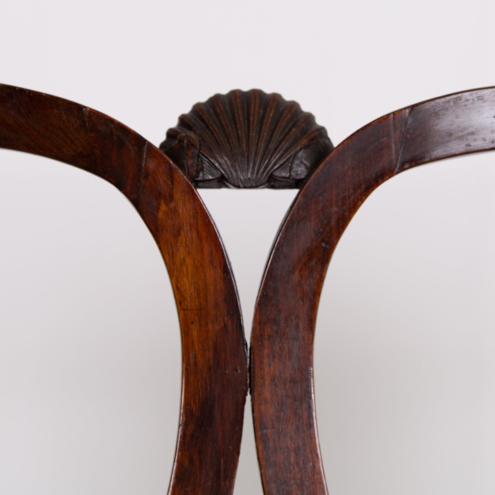 A George II revival double chair-back mahogany settee featuring carved vase splats, cabriole legs with claw and ball feet, and a green upholstered seat. View XI