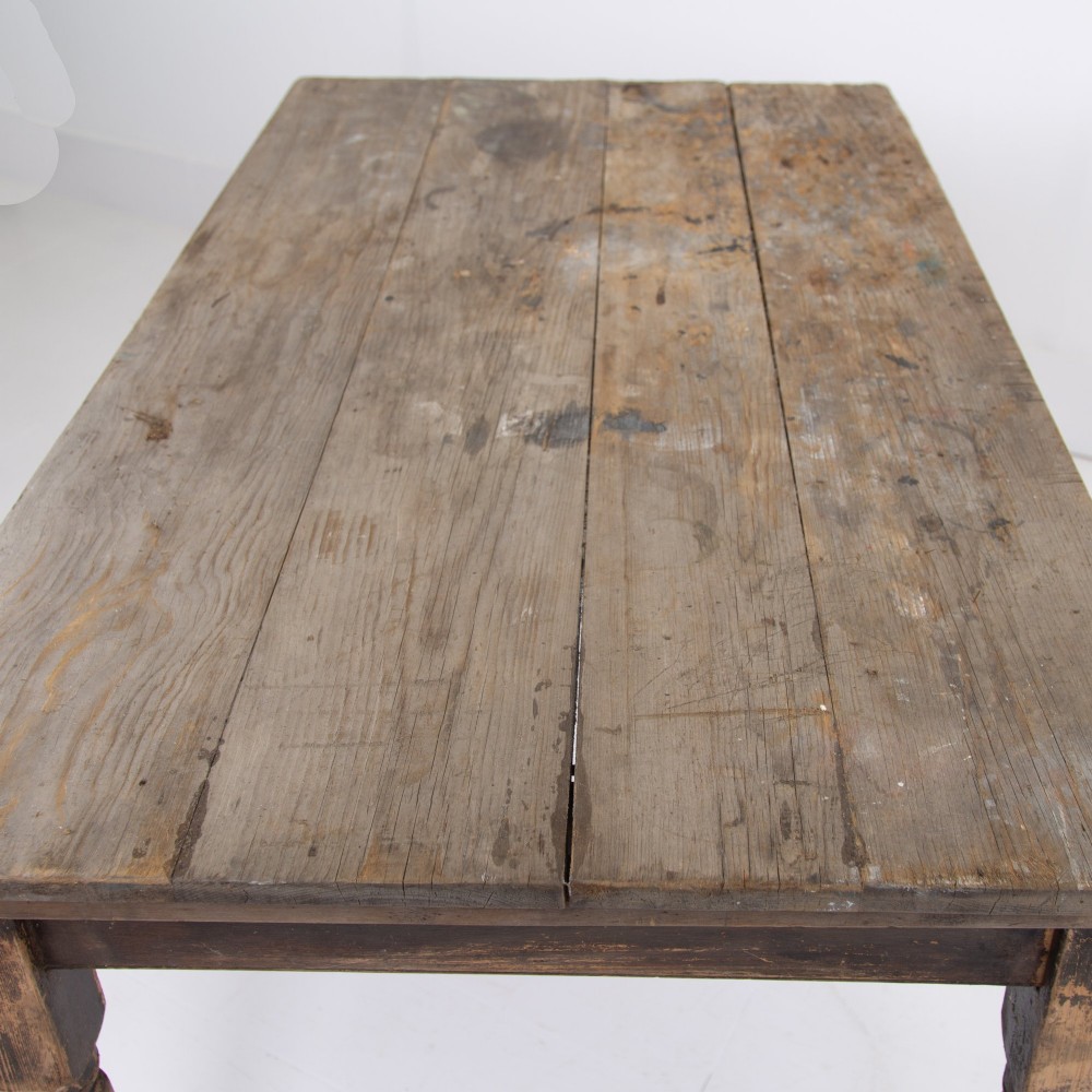 A late Victorian rustic wooden kitchen table featuring turned legs, a single drawer, and a distressed dark finish. View IV