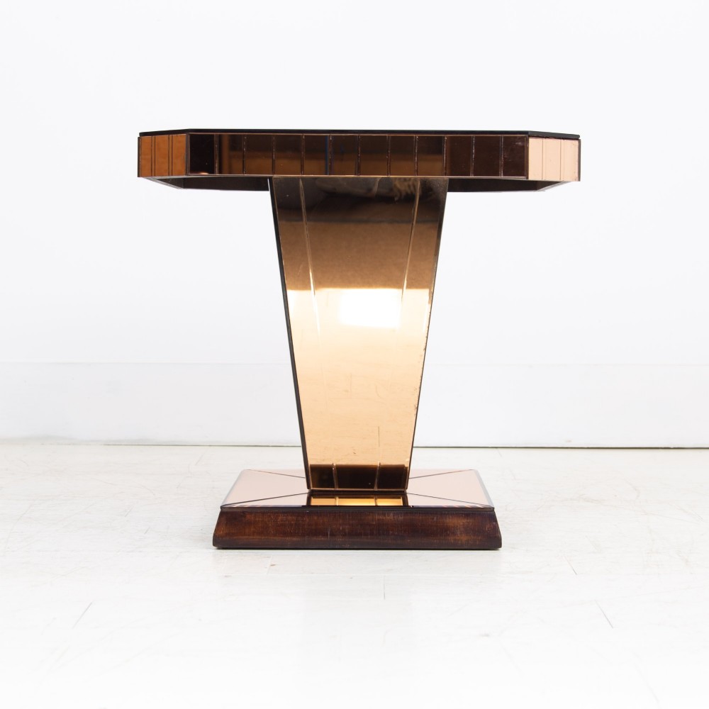 A pair of 1930s Art Deco side tables featuring peach-tinted mirrored tops, inverted pyramidal pedestal bases, and stepped square foundations. View II