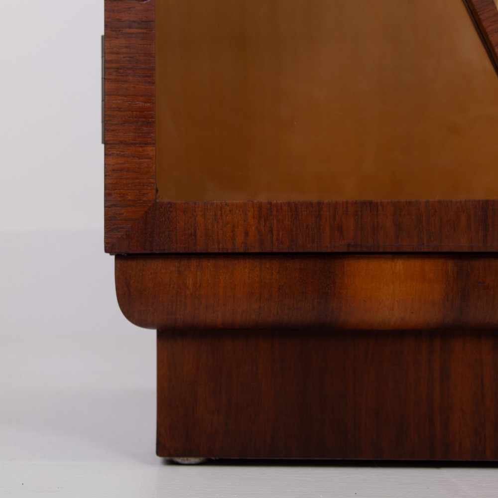 An Art Deco walnut display cabinet featuring a central burr walnut door flanked by two glazed doors with geometric diamond glazing bars. View XI