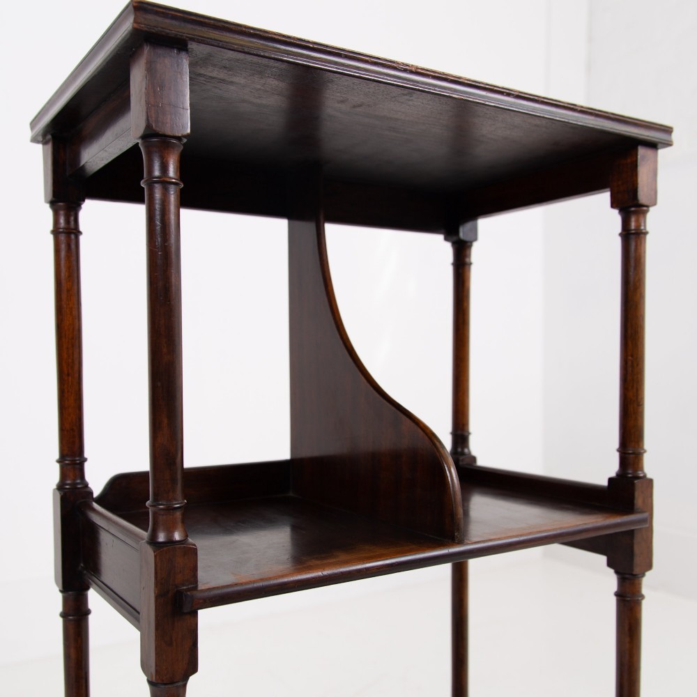 A dark brown mahogany Regency Revival whatnot with three open shelves, slender turned columns, and a vertical divider on the central tier. View IV