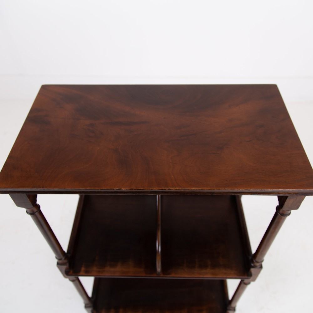 A dark brown mahogany Regency Revival whatnot with three open shelves, slender turned columns, and a vertical divider on the central tier. View V