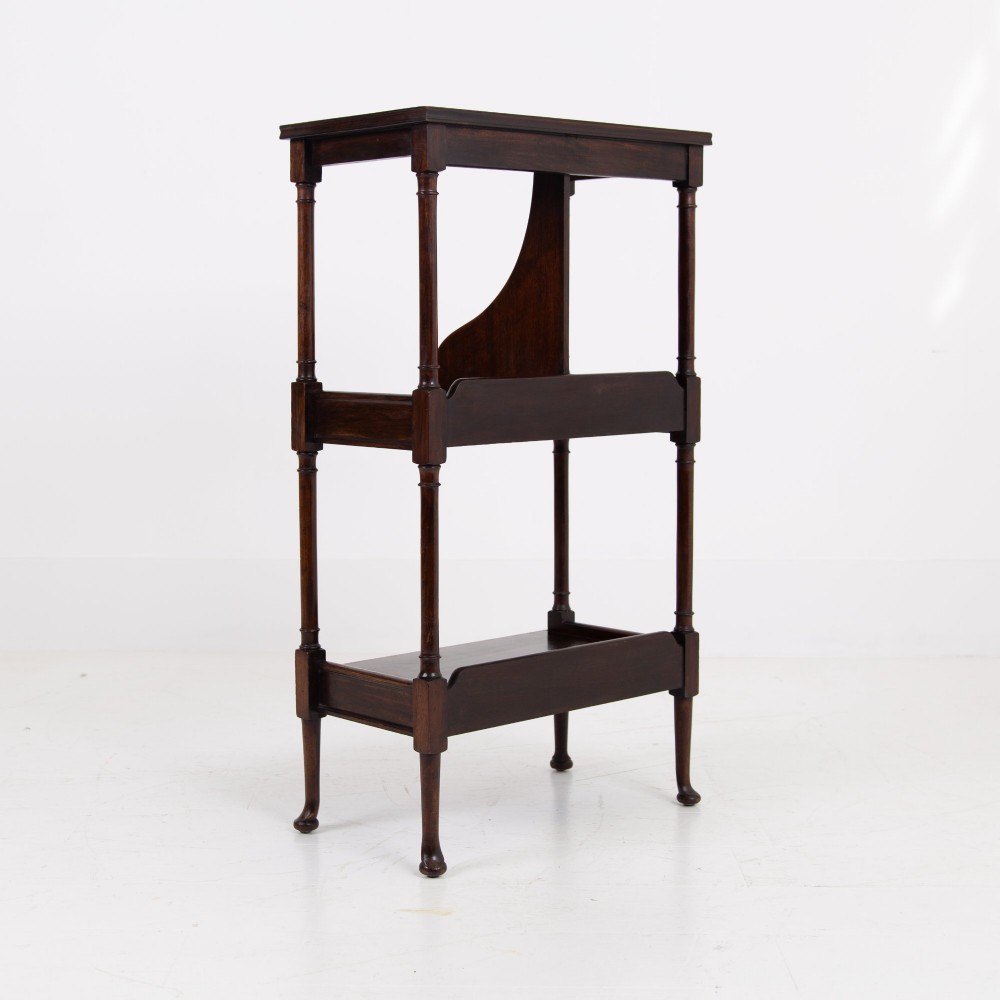 A dark brown mahogany Regency Revival whatnot with three open shelves, slender turned columns, and a vertical divider on the central tier. View VI