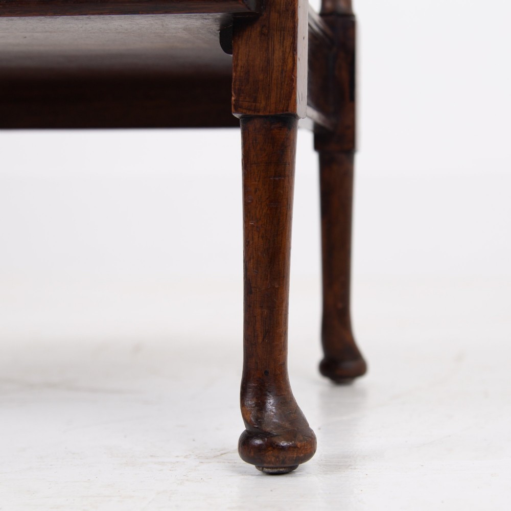 A dark brown mahogany Regency Revival whatnot with three open shelves, slender turned columns, and a vertical divider on the central tier. View VIII
