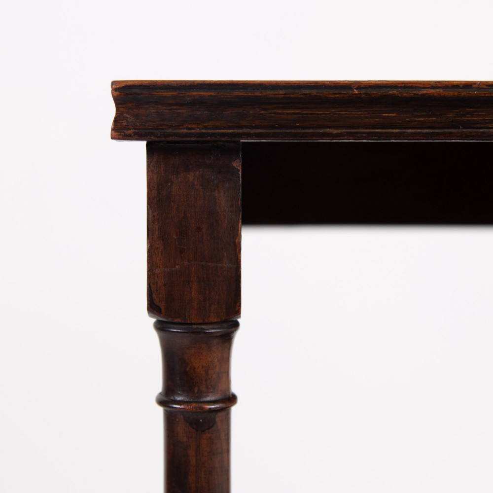 A dark brown mahogany Regency Revival whatnot with three open shelves, slender turned columns, and a vertical divider on the central tier. View X