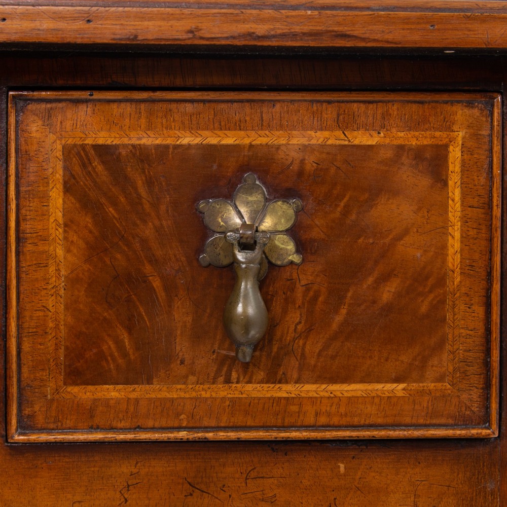 An antique warm brown walnut lowboy table featuring three drawers with brass handles, a shaped apron, and four cabriole legs ending in pad feet. View IV
