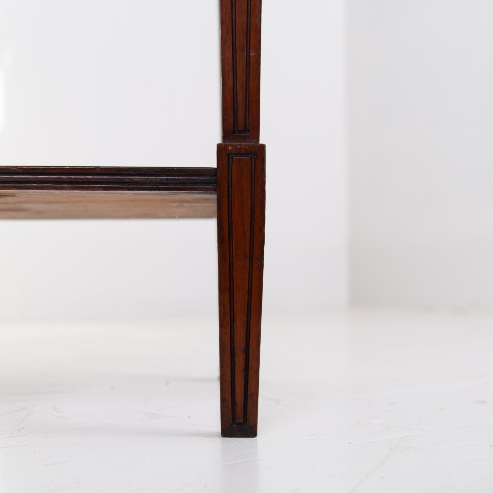 An Aesthetic Movement dark mahogany glazed cabinet with an intricate fretwork upper superstructure, mirrored back, twin glass doors, and a open lower shelf. View X