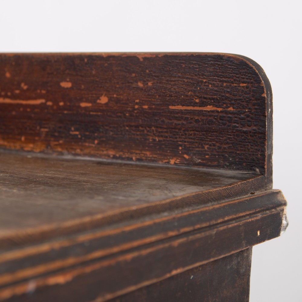 A 19th-century dark brown painted wooden kitchen dresser with seven drawers, a central cupboard, wooden knobs, and turned feet. View IX