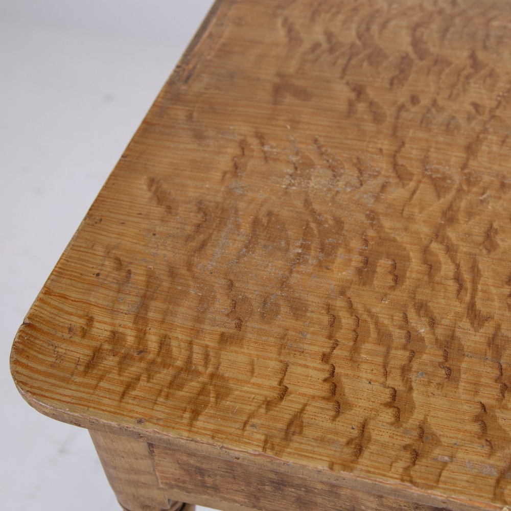 A 19th-century pine side table featuring two drawers with wooden knob handles, supported by slender turned legs. View VI