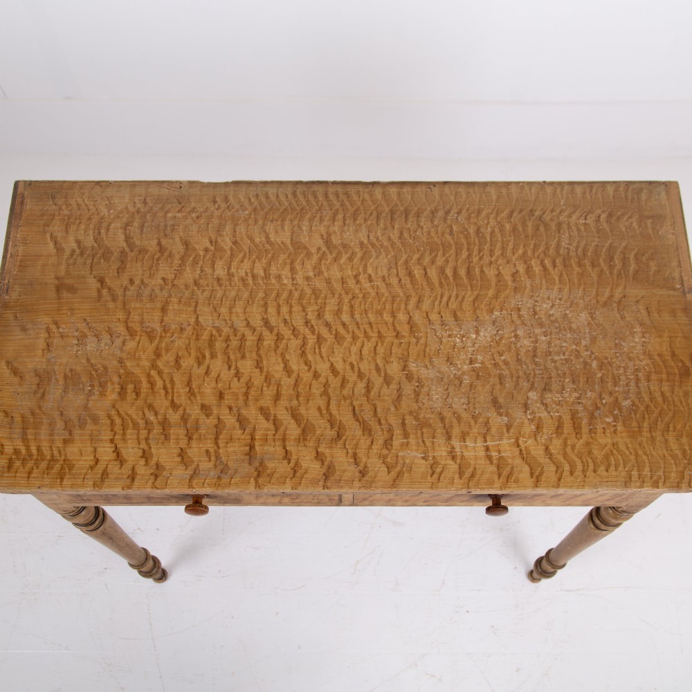 A 19th-century pine side table featuring two drawers with wooden knob handles, supported by slender turned legs. View XI