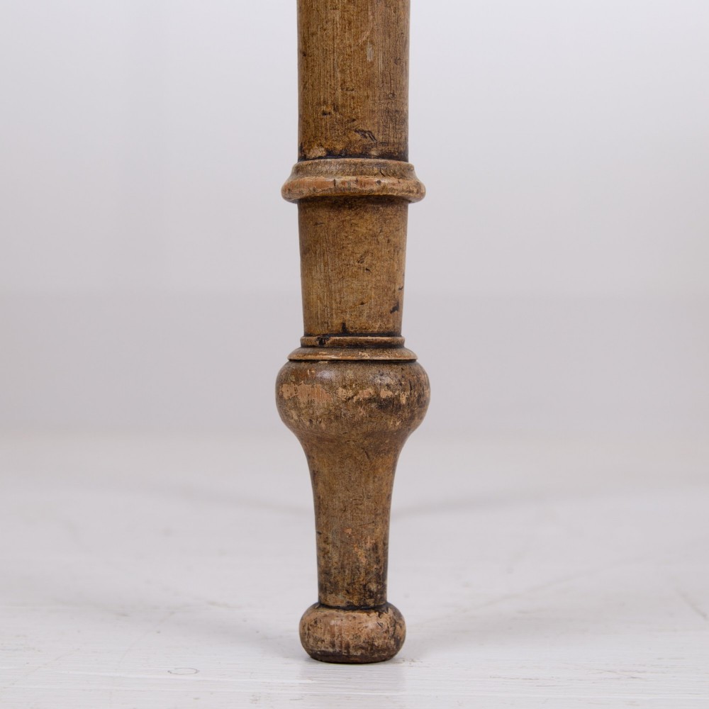 A 19th-century pine side table featuring two drawers with wooden knob handles, supported by slender turned legs. View XII