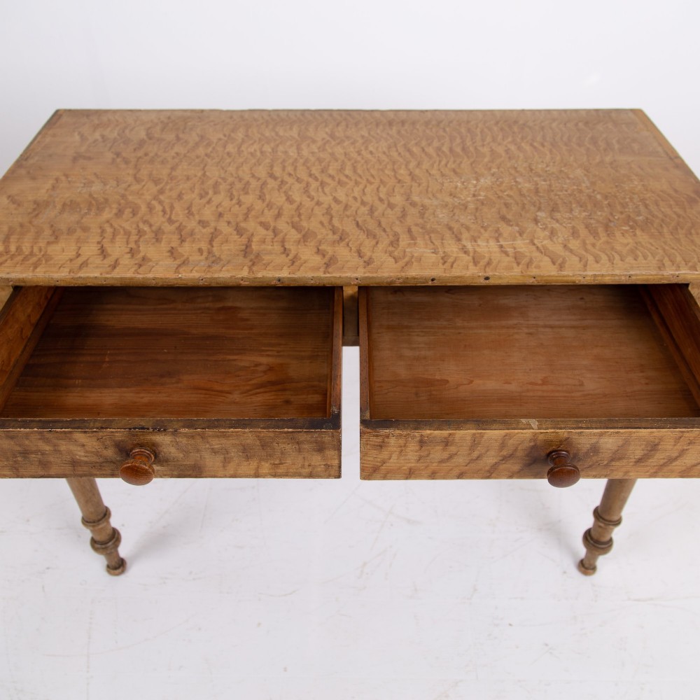 A 19th-century pine side table featuring two drawers with wooden knob handles, supported by slender turned legs. View XIV