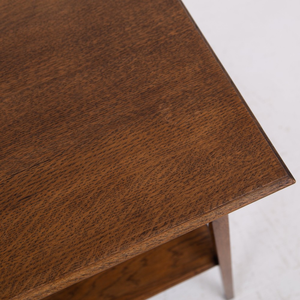 An Arts and Crafts solid oak two-tier side table with tapered legs and heart-shaped pierced motifs along the apron. View IX