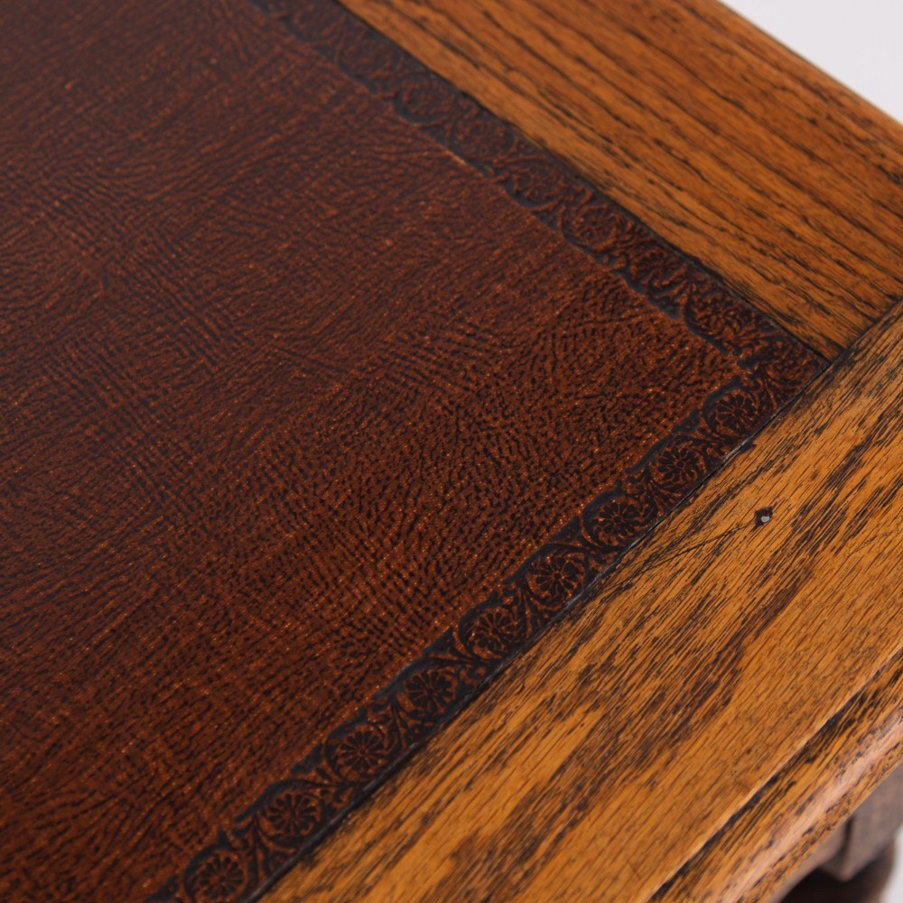An antique English oak side table featuring a single drawer with metal drop handles, set upon four barley twist legs connected by an H-stretcher base. View VIII