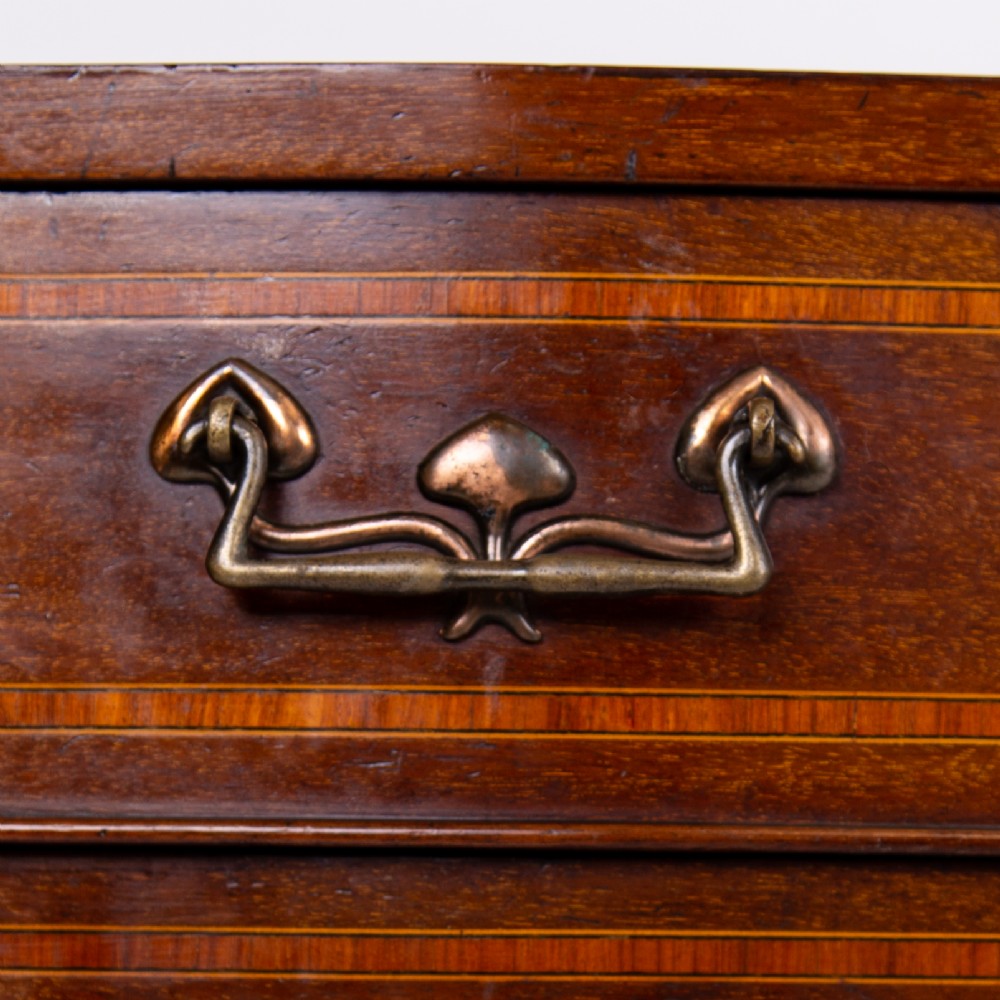 A matching pair of dark mahogany Edwardian cabinets featuring five inlaid drawers, slender cabriole legs, and an open top tray shelf. View IV