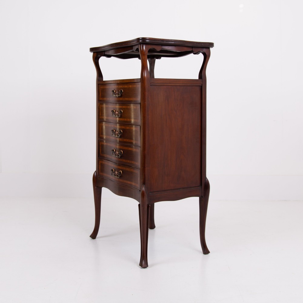A matching pair of dark mahogany Edwardian cabinets featuring five inlaid drawers, slender cabriole legs, and an open top tray shelf. View XII