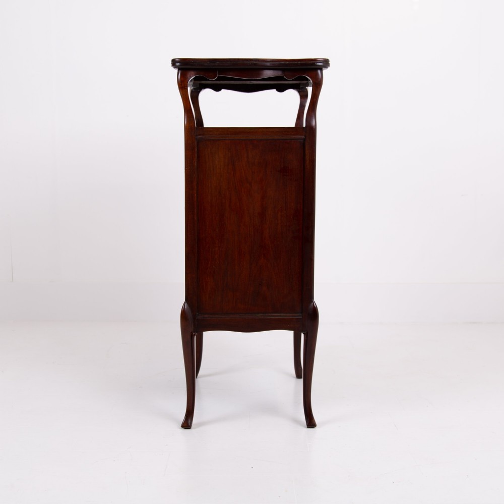 A matching pair of dark mahogany Edwardian cabinets featuring five inlaid drawers, slender cabriole legs, and an open top tray shelf. View XIII