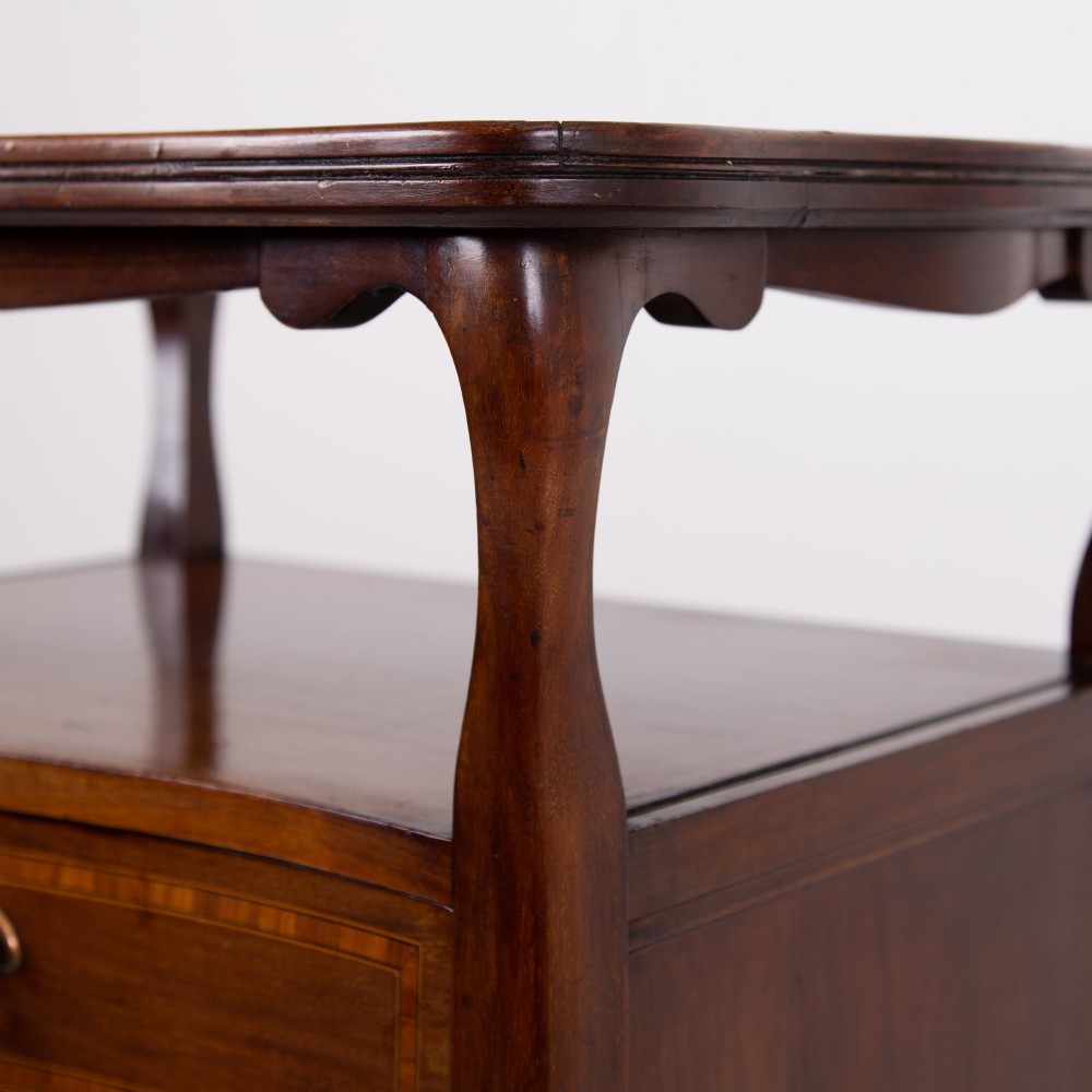 A matching pair of dark mahogany Edwardian cabinets featuring five inlaid drawers, slender cabriole legs, and an open top tray shelf. View XIV
