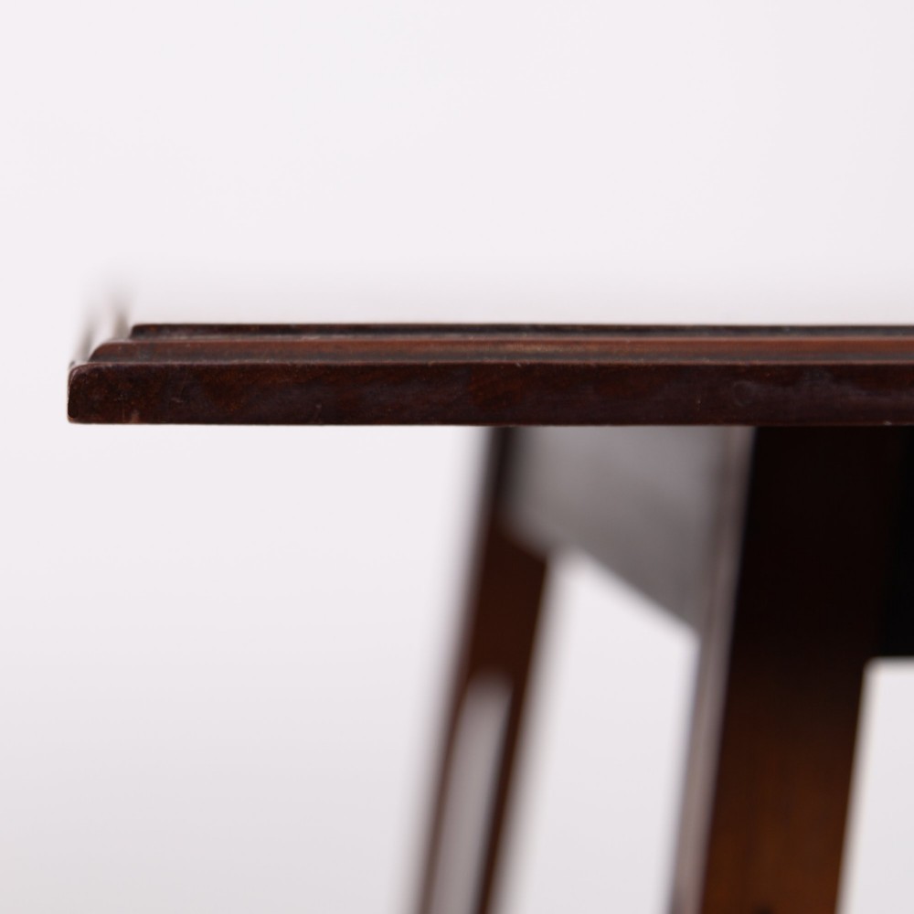 A late Victorian two-tier walnut side table featuring square splayed legs and a lower shelf enclosed by a pierced fretwork gallery. View X