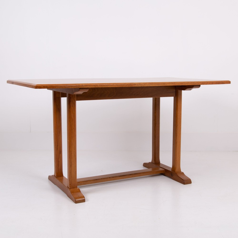 A 1930s Heals oak dining table featuring a rectangular solid timber top supported by a double-upright trestle base. View III