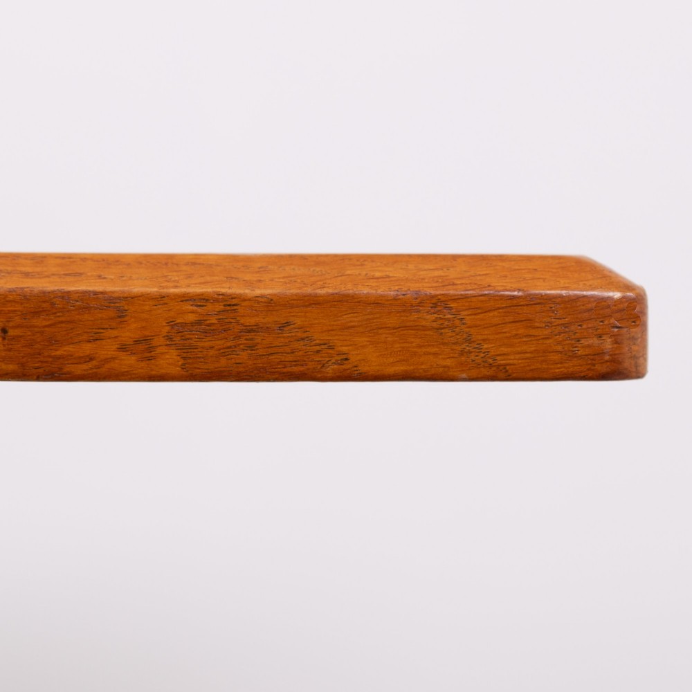 A 1930s Heals oak dining table featuring a rectangular solid timber top supported by a double-upright trestle base. View IV