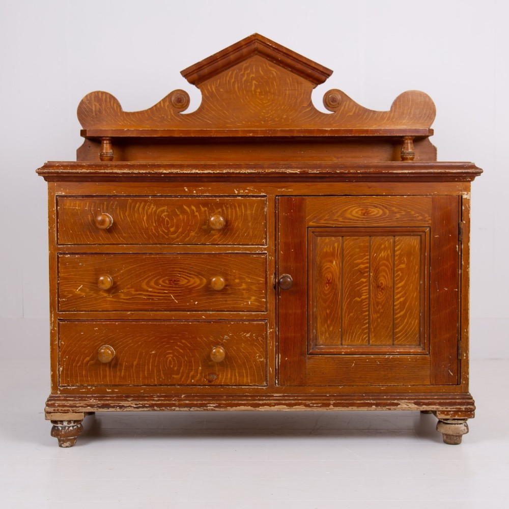 A Victorian scumble-painted pine kitchen dresser with three drawers, a cupboard door, turned knobs, and a galleried splashback shelf. View III